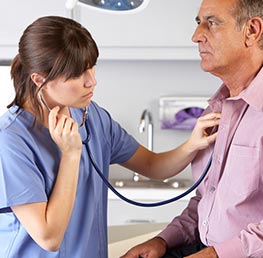 photo of a doctor examining an elderly patient